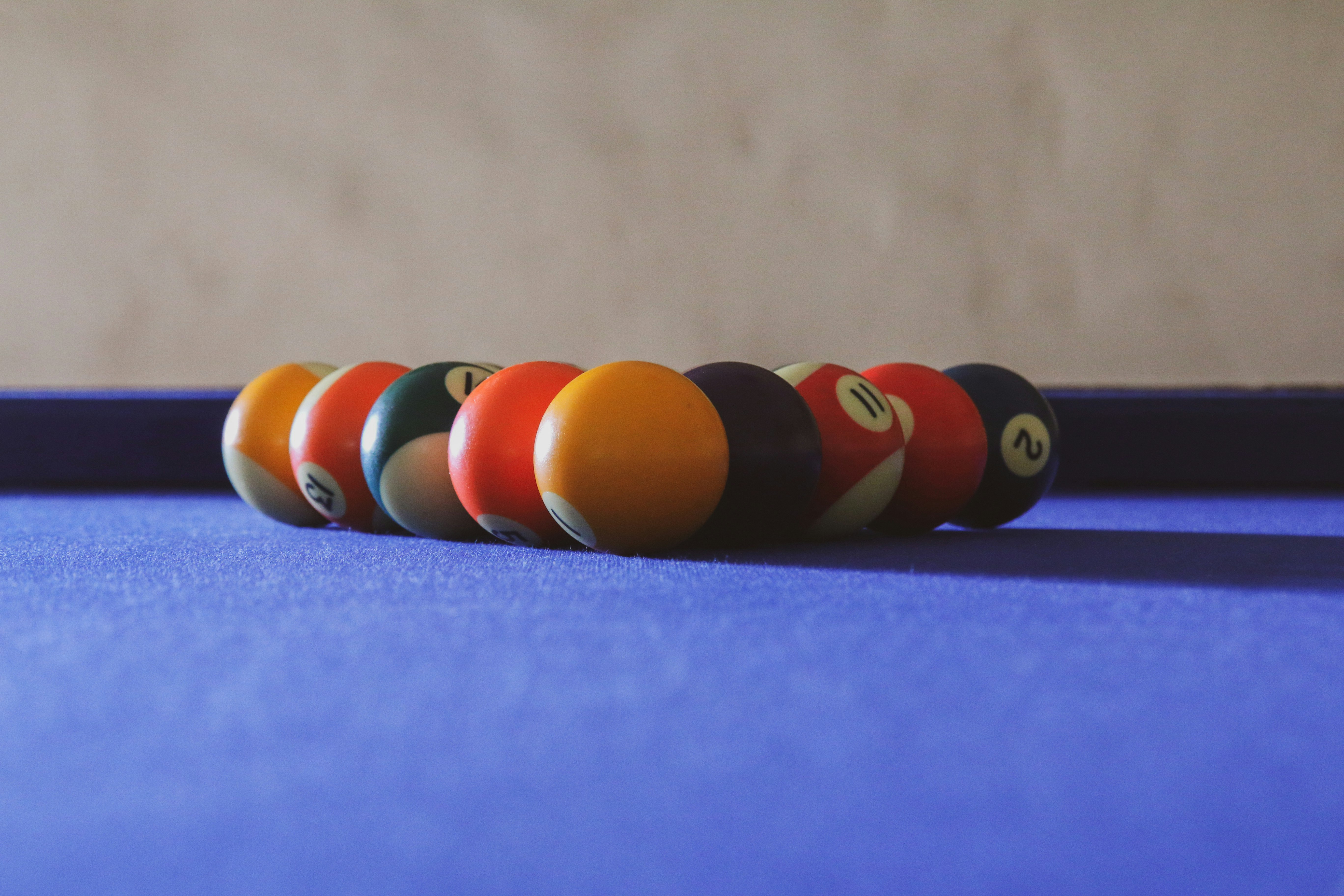 red yellow and green billiard balls on blue surface